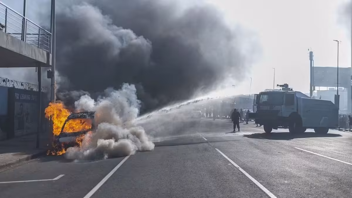 Cars torched and shops looted as anti-migrant violence erupts in South Africa