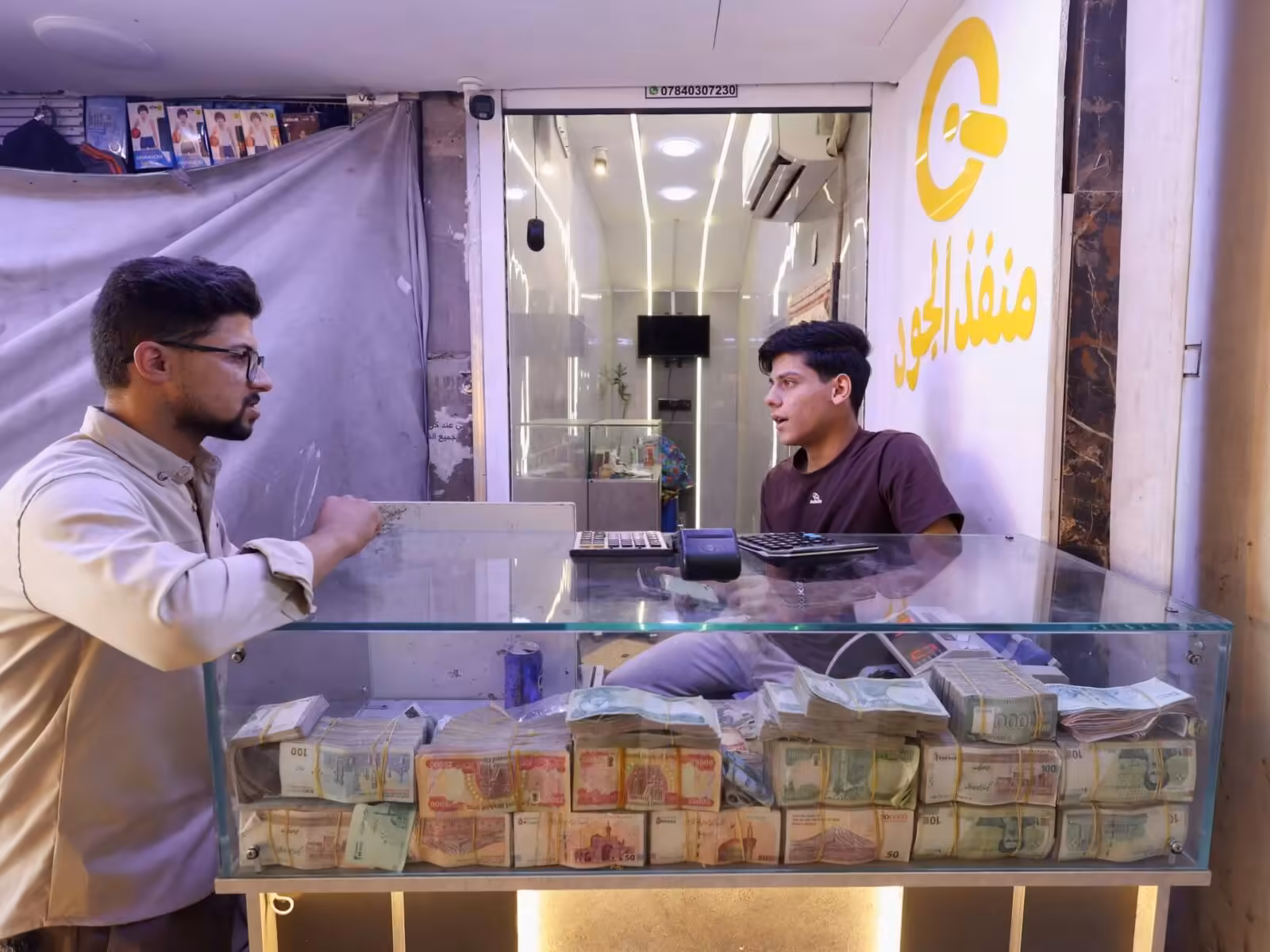 Iraq devalues its currency but some MPs oppose it | Business and Economy News